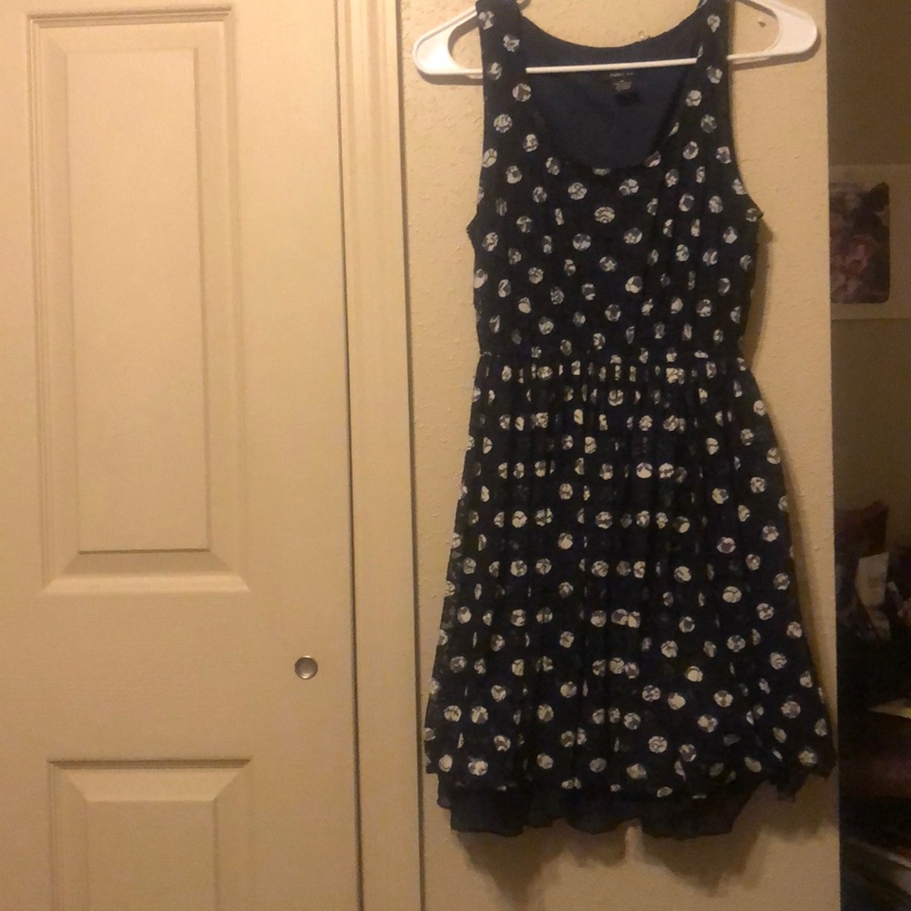 A navy polka dot dress
